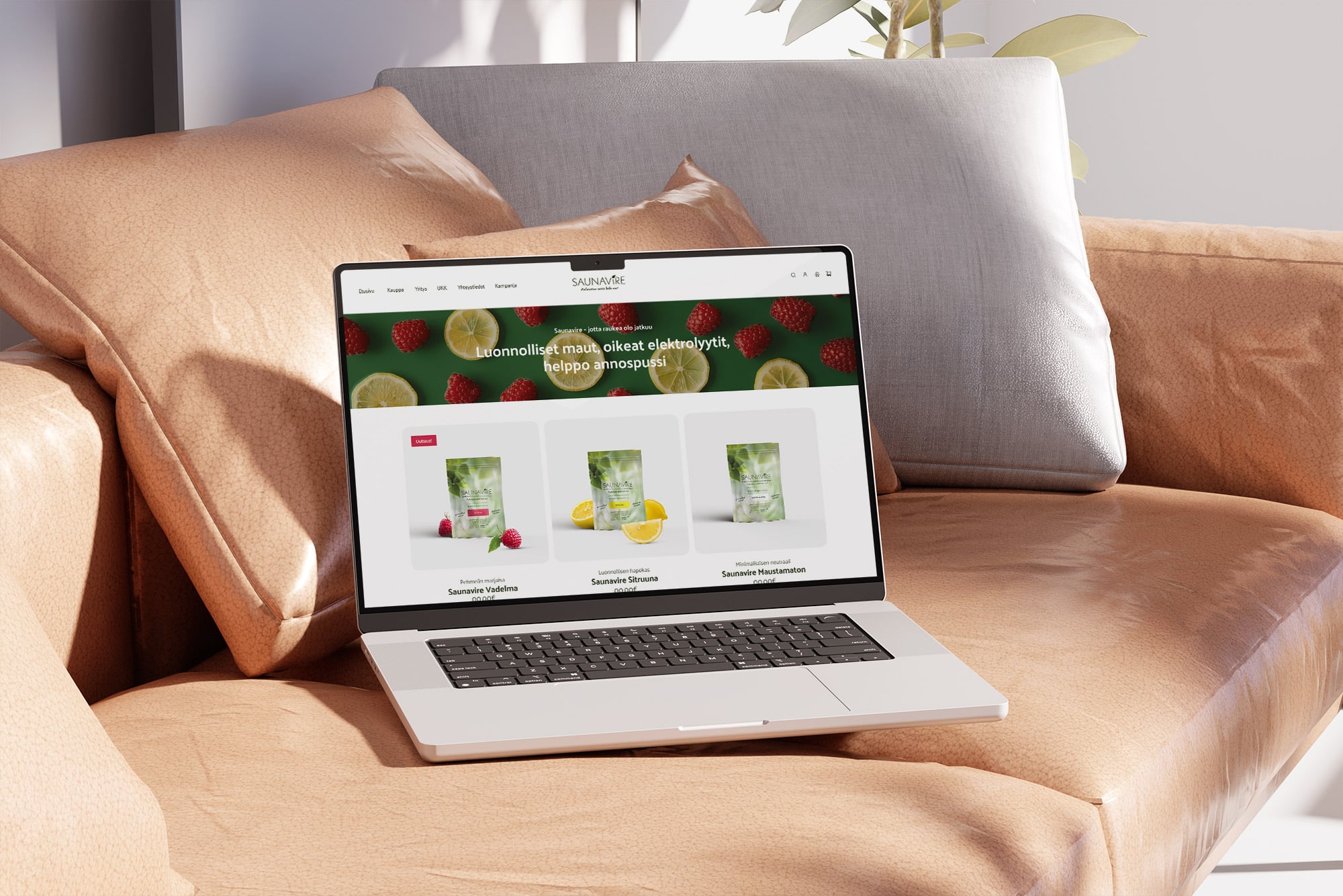 Laptop on a leather sofa showing the Saunavire shop page with three flavour pouches on a berry banner.
