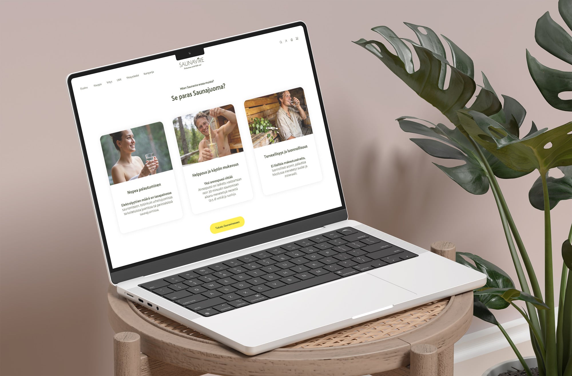 Laptop beside a monstera plant showing a three-card benefits section of the Saunavire store.